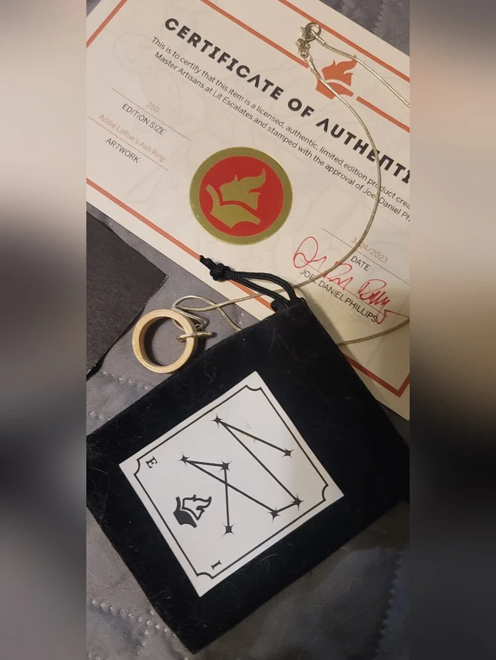 Lit Escalates Addie LaRue Wooden Ring Necklace